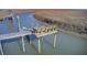 Scenic view from the creek, featuring the dock with a bench, kayak lift, and stairs with surrounding scenery at 7759 Edingsville Beach Rd, Edisto Island, SC 29438