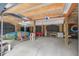 Spacious garage featuring ample storage, natural lighting, and enough room for a car and sporting equipment at 7759 Edingsville Beach Rd, Edisto Island, SC 29438