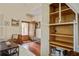 Cozy living room with skylight, comfortable seating, hardwood floors, and a built-in cabinet at 7759 Edingsville Beach Rd, Edisto Island, SC 29438