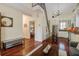 Open-concept interior boasting hardwood floors, stairs and a beautifully appointed kitchen at 7759 Edingsville Beach Rd, Edisto Island, SC 29438