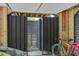 Enclosed outdoor shower with privacy slats, nestled among a bed of pebbles and wooden beams at 7759 Edingsville Beach Rd, Edisto Island, SC 29438