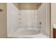 Bright bathroom featuring a clean white tub and shower with built-in shelving at 804 Buckthorn Cir, Summerville, SC 29483