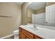 Bathroom featuring a vanity with drawers, sink, mirror, toilet and shower/tub enclosure with a curved shower curtain rod at 804 Buckthorn Cir, Summerville, SC 29483