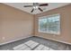 Cozy bedroom featuring natural light, carpeted floor, neutral-toned walls, ceiling fan, and a large window at 804 Buckthorn Cir, Summerville, SC 29483