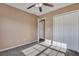 Carpeted bedroom with a ceiling fan, closet and doorway flooded with natural light at 804 Buckthorn Cir, Summerville, SC 29483