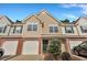 Charming two-story townhome with a one car garage, manicured landscaping, and a welcoming entrance at 804 Buckthorn Cir, Summerville, SC 29483