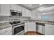 Kitchen featuring stainless appliances, granite countertops, and a pass-through to the living room at 804 Buckthorn Cir, Summerville, SC 29483