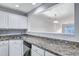 Kitchen featuring granite countertops, stainless appliances, and a pass-through to the living area at 804 Buckthorn Cir, Summerville, SC 29483