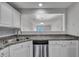 Kitchen featuring granite countertops, stainless appliances, and a pass-through to the living area at 804 Buckthorn Cir, Summerville, SC 29483