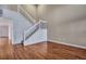 Charming living room showcasing a staircase and lustrous hardwood floors at 804 Buckthorn Cir, Summerville, SC 29483
