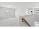 Bright, open bonus room with plush carpeting, large windows, and neutral walls for versatile use at 808 Alma Square Dr, Moncks Corner, SC 29461
