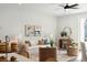Inviting living room with neutral-toned furnishings, decorative artwork, and an open flow to the kitchen and dining area at 808 Alma Square Dr, Moncks Corner, SC 29461
