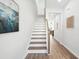A staircase featuring wood treads, white risers, and a wood handrail at 808 Alma Square Dr, Moncks Corner, SC 29461
