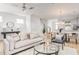 Spacious living room featuring neutral tones and open floor plan into dining area at 810 Alma Square Dr, Moncks Corner, SC 29461