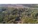 Scenic aerial shot of a house surrounded by trees and river streams at 8255 Chisolm Plantation Rd, Edisto Island, SC 29438