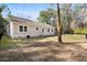 View of home's backyard, showing the expansive yard space and privacy fence at 8255 Chisolm Plantation Rd, Edisto Island, SC 29438