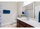 Bathroom with dark cabinets, white countertop, and good lighting at 8255 Chisolm Plantation Rd, Edisto Island, SC 29438