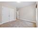 A cozy bedroom featuring plush carpeting and neutral color scheme at 8255 Chisolm Plantation Rd, Edisto Island, SC 29438