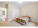 This bedroom boasts ample natural light, plush carpeting, and neutral decor at 8255 Chisolm Plantation Rd, Edisto Island, SC 29438