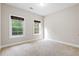 Bedroom with carpet floors and plenty of light from the window at 8255 Chisolm Plantation Rd, Edisto Island, SC 29438