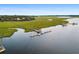 Aerial view of dock with a gazebo extending into the water, offering scenic waterfront access at 8255 Chisolm Plantation Rd, Edisto Island, SC 29438