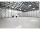 Large metal framed building or garage space with concrete flooring at 8255 Chisolm Plantation Rd, Edisto Island, SC 29438