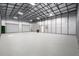 Spacious garage or workshop area with a metal frame and concrete flooring at 8255 Chisolm Plantation Rd, Edisto Island, SC 29438