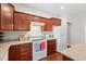 Kitchen featuring granite countertops, wooden cabinets, and modern appliances at 8255 Chisolm Plantation Rd, Edisto Island, SC 29438