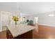 Open concept living area with hardwood floors and great light exposure with views to other rooms at 8255 Chisolm Plantation Rd, Edisto Island, SC 29438