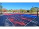 Outdoor basketball court with red, white, and blue surfaces, surrounded by a black fence at 8615 Arthur Hills Cir, North Charleston, SC 29420