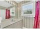 Bright bathroom features a single vanity, a large mirror, and a window allowing for natural light at 8615 Arthur Hills Cir, North Charleston, SC 29420
