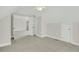 Spacious and bright bedroom with neutral carpet, large windows, and easy access to adjoining rooms at 8615 Arthur Hills Cir, North Charleston, SC 29420