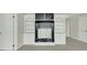 A bonus room with neutral walls and carpet features built in shelving and easy access to additional rooms at 8615 Arthur Hills Cir, North Charleston, SC 29420