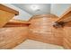 Cedar closet with walls and shelving constructed of wood planks and metal rods for hanging clothes at 8615 Arthur Hills Cir, North Charleston, SC 29420