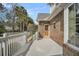Exterior deck provides access to the back entrance of the brick home at 8615 Arthur Hills Cir, North Charleston, SC 29420