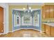 Bright dining area featuring bay windows offering abundant natural light and a view of the backyard at 8615 Arthur Hills Cir, North Charleston, SC 29420