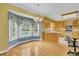 Eat-in kitchen area with blue walls, bay windows, and a view of the outside pool at 8615 Arthur Hills Cir, North Charleston, SC 29420