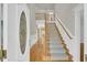 Elegant foyer with hardwood floors, staircase, and high ceilings at 8615 Arthur Hills Cir, North Charleston, SC 29420