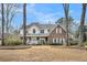 Charming brick and white two-story home with inviting front porch and well-maintained lawn at 8615 Arthur Hills Cir, North Charleston, SC 29420