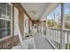 Charming front porch featuring rocking chairs and white railings at 8615 Arthur Hills Cir, North Charleston, SC 29420