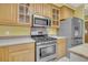 Well-equipped kitchen with stainless steel appliances, and wooden cabinets at 8615 Arthur Hills Cir, North Charleston, SC 29420