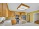 Well-lit kitchen with wooden cabinets, stainless steel appliances, and a center island for added workspace at 8615 Arthur Hills Cir, North Charleston, SC 29420