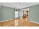 Bright living room featuring hardwood floors, large windows, and an elegant fireplace at 8615 Arthur Hills Cir, North Charleston, SC 29420