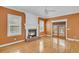 Bright living room with a brick fireplace and wooden floors, creating a warm and inviting space at 8615 Arthur Hills Cir, North Charleston, SC 29420
