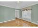 Bright living room featuring hardwood floors, large windows, and elegant trim at 8615 Arthur Hills Cir, North Charleston, SC 29420
