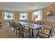 Conference room with large table, seating, and windows with Christmas decorations for a festive atmosphere at 8615 Arthur Hills Cir, North Charleston, SC 29420