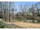 Scenic pond surrounded by mature trees and lush landscaping at 8615 Arthur Hills Cir, North Charleston, SC 29420