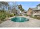 Backyard featuring a freeform pool, patio, and mature landscaping at 8615 Arthur Hills Cir, North Charleston, SC 29420