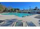 Large community pool with lap lanes, lounge chairs, and covered seating area on a sunny day at 8615 Arthur Hills Cir, North Charleston, SC 29420