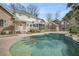 Beautiful pool with steps leading into the water, surrounded by a concrete patio and fenced yard at 8615 Arthur Hills Cir, North Charleston, SC 29420